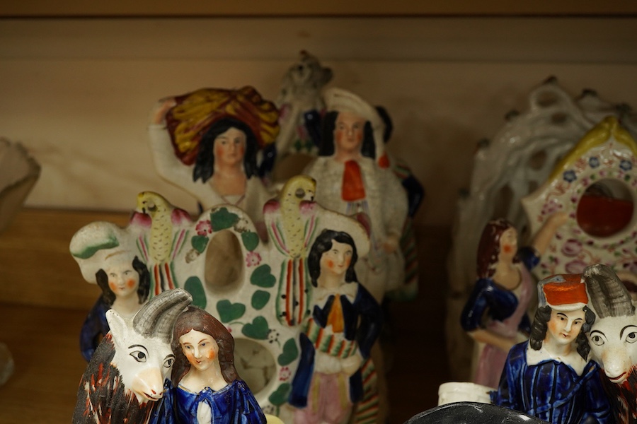 A collection of Victorian Staffordshire pottery figures, largest 32cm high